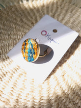 Nguru Ring in green and orange from Okapu’s Retrograde Collection, sustainable, handcrafted from upcycled materials.