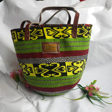 Kiondo tote woven with sisal and yarn. Okapu is a social enterprise making kiondos great. African bags handmade in Kenya with love for gifting and for elevating your fashion style.