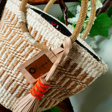 Neutral/ Nude top handle kiondo okapu with beaded round handles. Holiday or Vacation bag. Okapu is a social enterprise making kiondos great. African bags handmade in Kenya with love for gifts for women and to elevate their fashion style.