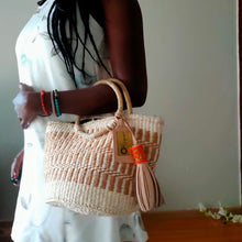 Neutral/ Nude top handle kiondo okapu with beaded round handles. Holiday or Vacation bag. Okapu is a social enterprise making kiondos great. African bags handmade in Kenya with love for gifts for women and to elevate their fashion style.