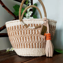 Neutral/ Nude top handle kiondo okapu with beaded round handles. Holiday or Vacation bag. Okapu is a social enterprise making kiondos great. African bags handmade in Kenya with love for gifts for women and to elevate their fashion style.